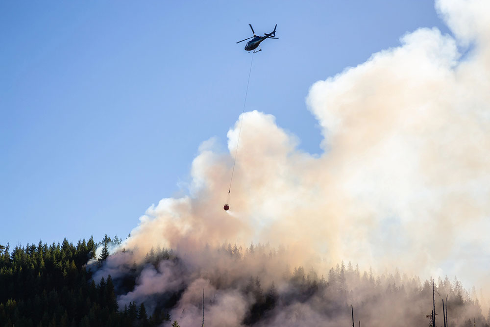 Helicopter fighting wildfire in BC.